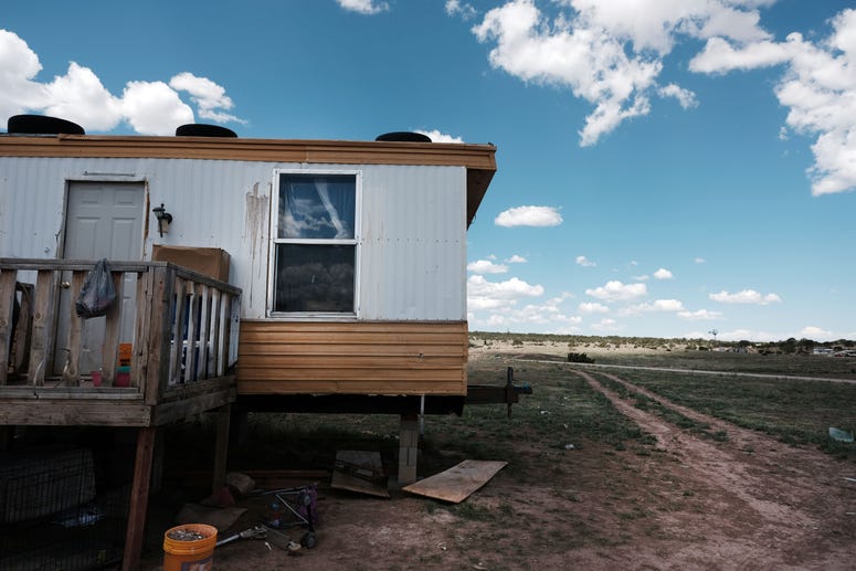 THOREAU, NEW MEXICO - JUNE 06: A trailer stands on land belonging to members of the Navajo Nation in the town of Thoreau on June 06, 2019 in Thoreau, New Mexico. THOREAU, NEW MEXICO - JUNE 06: A trailer stands on land belonging to members of the Navajo Nation in the town of Thoreau on June 06, 2019 in Thoreau, New Mexico.