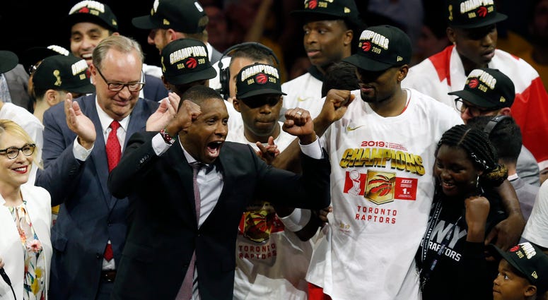 Toronto Raptors President Masai Ujiri celebrates with players after the team defeated the Golden State Warriors to win the NBA Finals on June 13, 2019. Toronto Raptors President Masai Ujiri celebrates with players after the team defeated the Golden State Warriors to win the NBA Finals on June 13, 2019.