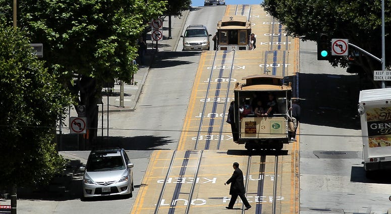 Cable cars travel along Powell Street on June 9, 2011 in San Francisco, California. Cable cars travel along Powell Street on June 9, 2011 in San Francisco, California.