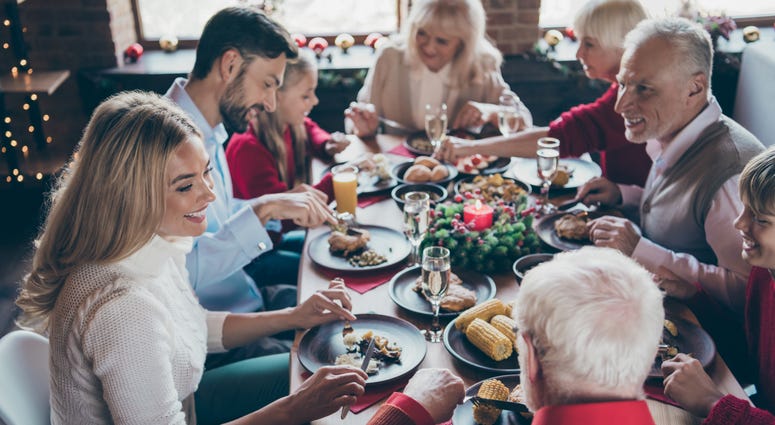A family eats a meal during the holidays.