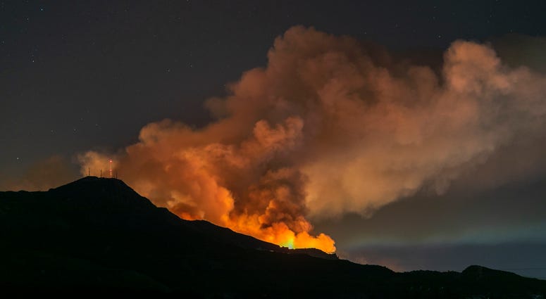 The Maria Fire burns on a hillside as it expands up to 8,000 acres on its first night on November 1, 2019 near Somis, California. The Maria Fire burns on a hillside as it expands up to 8,000 acres on its first night on November 1, 2019 near Somis, California.