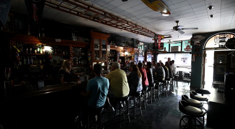 athy Sanchez bartends at The Town Square bar where the lights are out on October 10, 2019 in Sonoma, California. athy Sanchez bartends at The Town Square bar where the lights are out on October 10, 2019 in Sonoma, California.