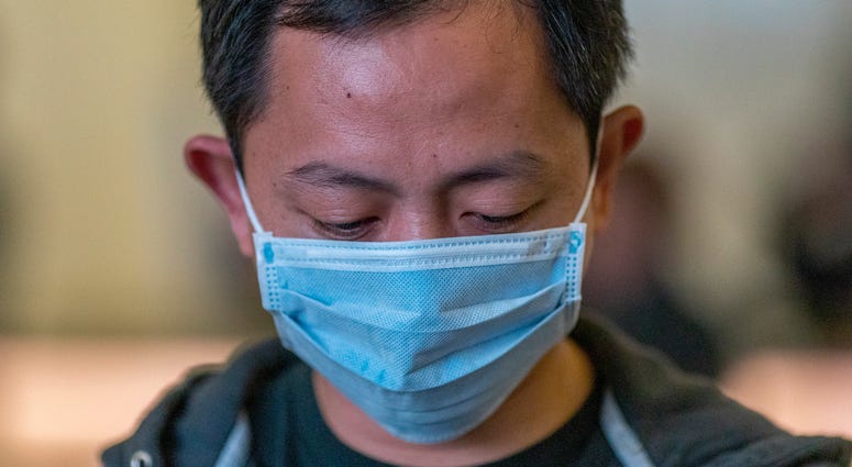 Travelers arrive to LAX Tom Bradley International Terminal wearing medical masks for protection against the novel coronavirus outbreak on February 2, 2020 in Los Angeles. Travelers arrive to LAX Tom Bradley International Terminal wearing medical masks for protection against the novel coronavirus outbreak on February 2, 2020 in Los Angeles.