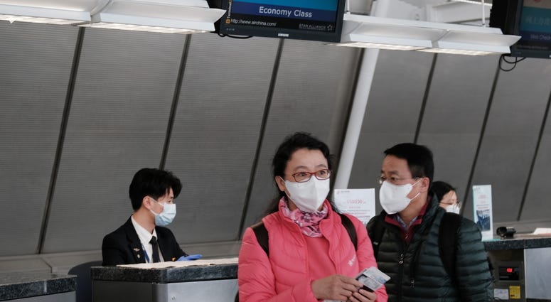 At the terminal that serves planes bound for China, people wear medical masks at John F. Kennedy Airport (JFK) out of concern over the Coronavirus on January 31, 2020 in New York City. At the terminal that serves planes bound for China, people wear medical masks at John F. Kennedy Airport (JFK) out of concern over the Coronavirus on January 31, 2020 in New York City.