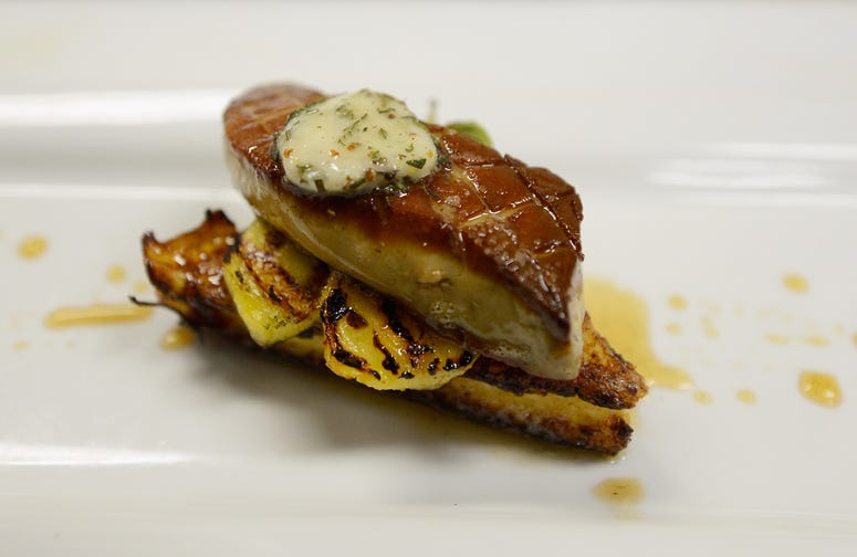 Foie gras dishes are prepared at Hot's Kitchen during a "Farewell Fois Gras" event on June 29, 2012 in Hermosa Beach, California. Foie gras dishes are prepared at Hot's Kitchen during a "Farewell Fois Gras" event on June 29, 2012 in Hermosa Beach, California.