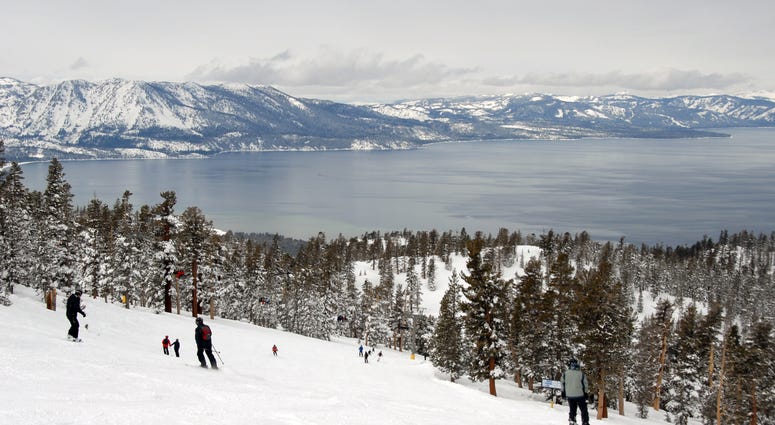 Skiers and snowboarders near Lake Tahoe. Skiers and snowboarders near Lake Tahoe.