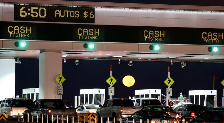 The moon sets as traffic backs up at the San Francisco-Oakland Bay Bridge toll plaza while commuters make their way into San Francisco on the first day of the (Bay Area Rapid Transit) BART strike on October 18, 2013 in Oakland, California. The moon sets as traffic backs up at the San Francisco-Oakland Bay Bridge toll plaza while commuters make their way into San Francisco on the first day of the (Bay Area Rapid Transit) BART strike on October 18, 2013 in Oakland, California.