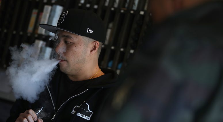 Jeremy Wong blows vapor from an e-cigarette at The Vaping Buddha on January 23, 2018 in South San Francisco, California. Jeremy Wong blows vapor from an e-cigarette at The Vaping Buddha on January 23, 2018 in South San Francisco, California.