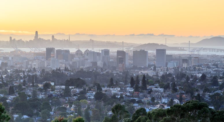 San Francisco and Oakland at sunset. San Francisco and Oakland at sunset.