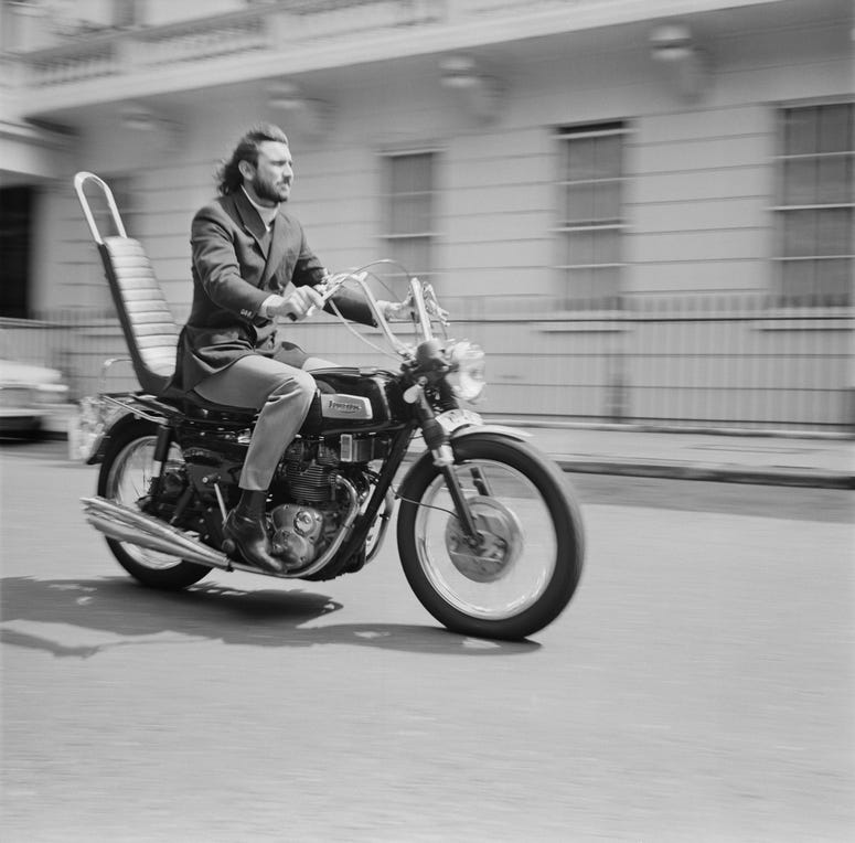 Australian actor and former model George Lazenby on his motorcycle, UK, 27th July 1970. Australian actor and former model George Lazenby on his motorcycle, UK, 27th July 1970.