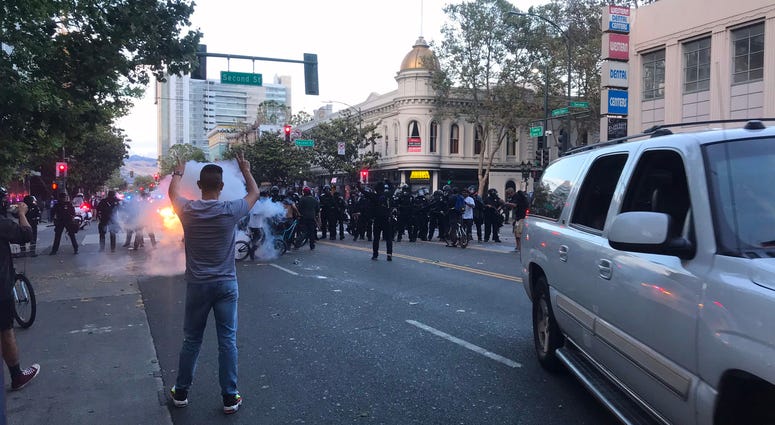 A small fire burns at a George Floyd protest in San Jose.