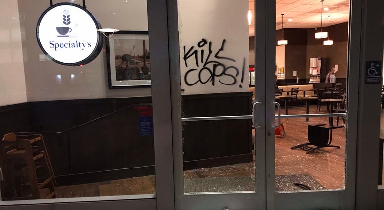 Smashed windows at a business in downtown Oakland.