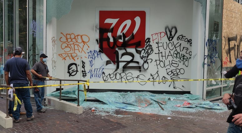 Graffiti seen at a Walgreens location in downtown Oakland following Friday's protest.