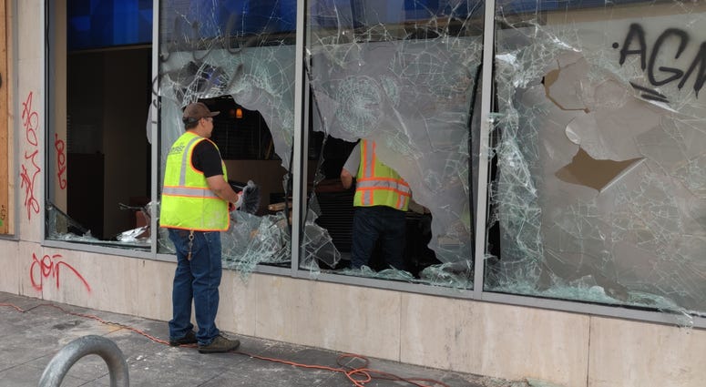 Smashed glass seen in Downtown Oakland following Friday's protest.
