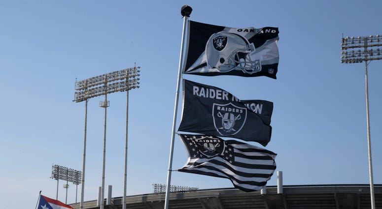 Flags wave outside of Oakland Alameda County Coliseum. Flags wave outside of Oakland Alameda County Coliseum.