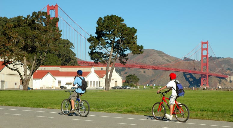 Cyclists in San Francisco near Golden Gate Bridge. Cyclists in San Francisco near Golden Gate Bridge.