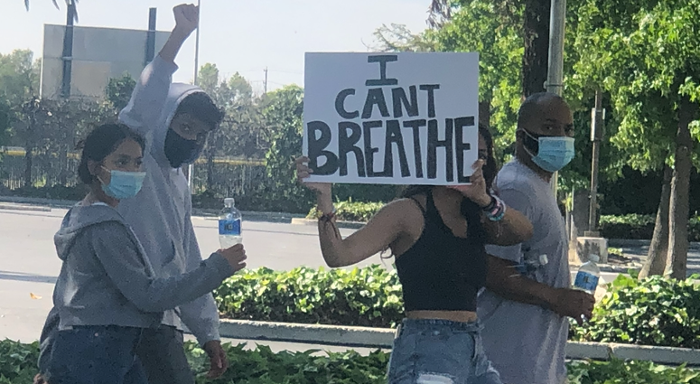 Protesters advance towards City Hall after blocking traffic in San Jose.