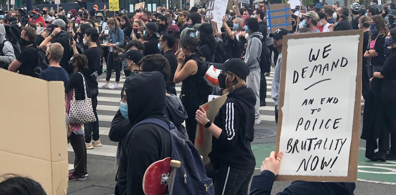 A protester holds a sign at a San Francisco George Floyd rally. A protester holds a sign at a San Francisco George Floyd rally.