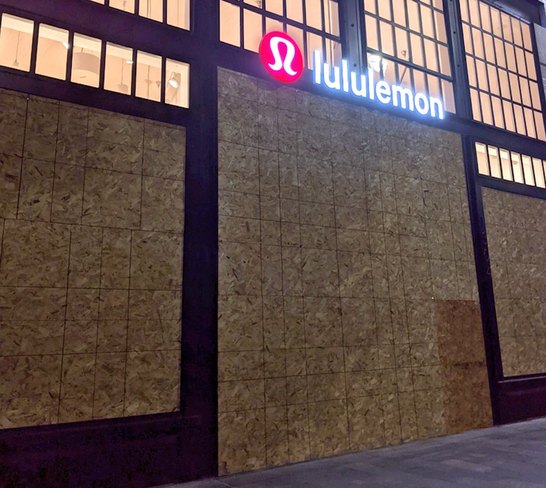 One of several stores boarded up with plywood in downtown Burlingame. One of several stores boarded up with plywood in downtown Burlingame.