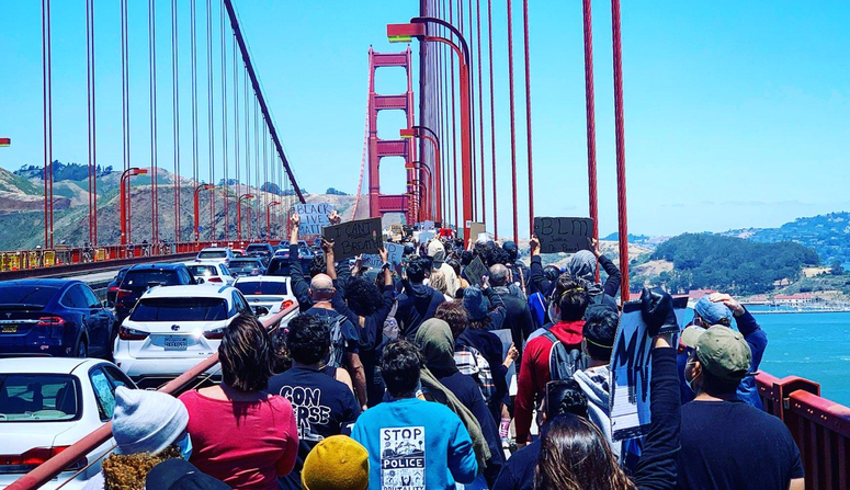 testers march across the Golden Gate Bridge in support of the Black Lives Matter movement. Protesters march across the Golden Gate Bridge in support of the Black Lives Matter movement.