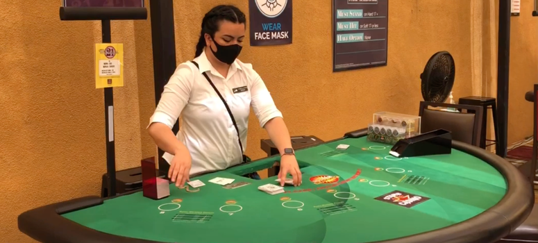 A dealer shuffles cards at a socially-distanced table at Stars Casino in Tracy. A dealer shuffles cards at a socially-distanced table at Stars Casino in Tracy.