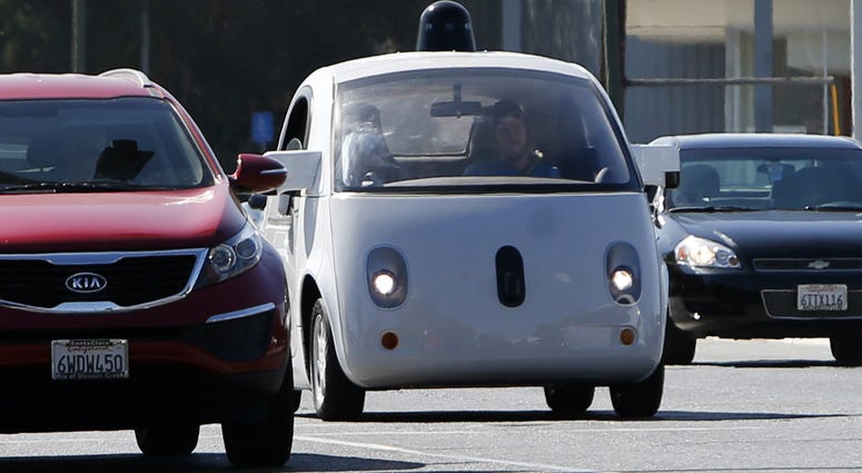 A Google self-driving car travels eastbound on San Antonio Road in Mountain View, Calif.