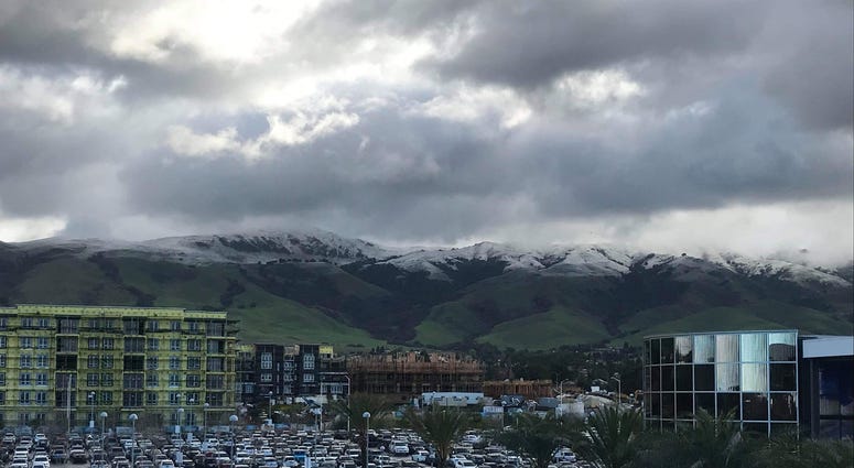 Snow was visible in the hills above the Warm Springs BART station on Feb. 5, 2019