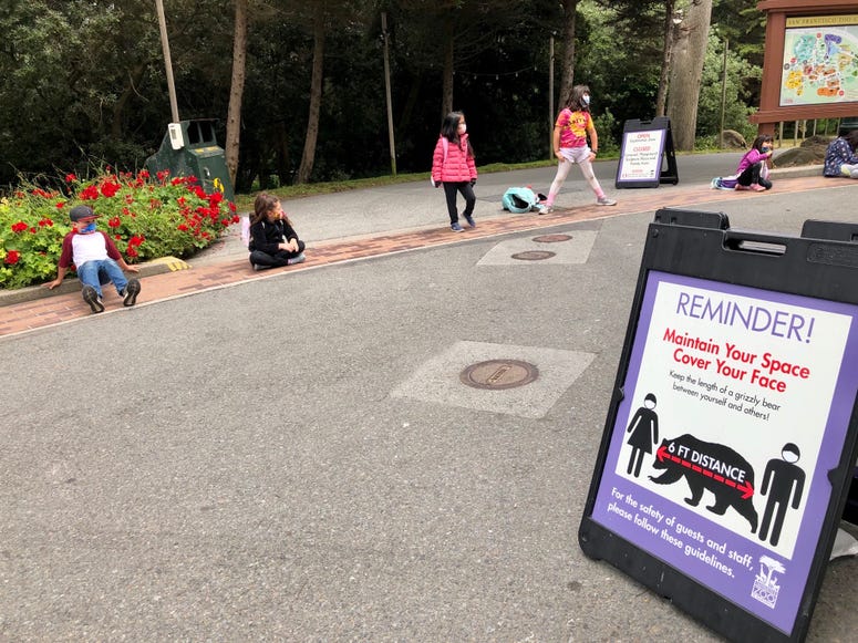 A marker explains distancing requirements at the San Francisco Zoo. A marker explains distancing requirements at the San Francisco Zoo.