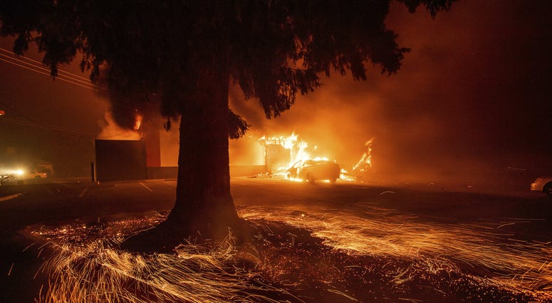 Flames consume a Kentucky Fried Chicken as the Camp Fire tears through Paradise, Calif., on Thursday, Nov. 8, 2018