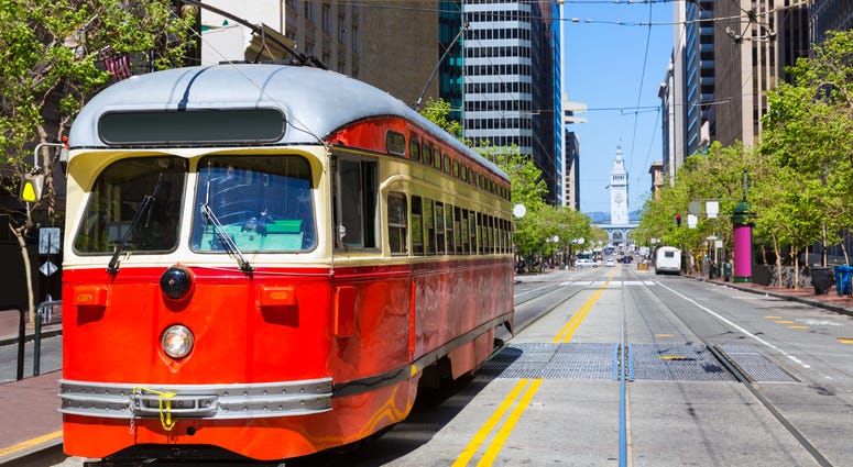 Street car on Market Street, with Ferry Building in background Street car on Market Street, with Ferry Building in background