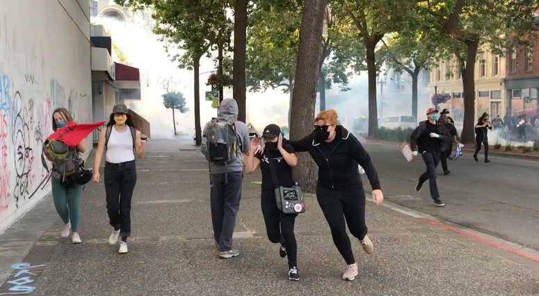 15,000 march peacefully in Oakland; tear gas, rubber bullets used as curfew falls