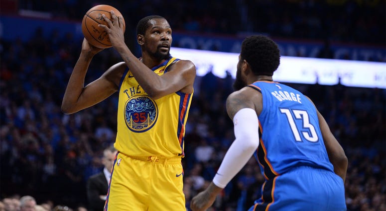 Golden State Warriors Kevin Durant Apr 3, 2018; Oklahoma City, OK, USA; Golden State Warriors forward Kevin Durant (35) handles the ball in front of Oklahoma City Thunder forward Paul George (13) during the second quarter at Chesapeake Energy Arena. Mandatory Credit: Mark D. Smith-USA TODA