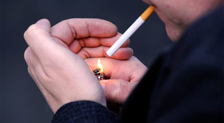 Smoker 10/14/2016 - PICTURE POSED BY MODEL File photo dated 12/03/13 of a man lighting a cigarette. Half of smokers delay quitting for years because they worry about getting fat, a survey has suggested. (Photo by PA Images/Sipa USA)