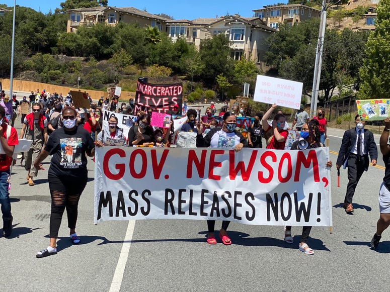 Protestors march to San Quentin calling for the mass release of prisoners.