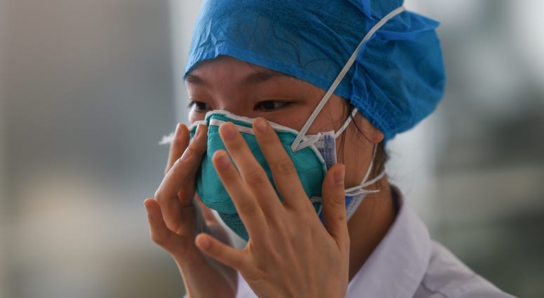 A medical worker learns how to wear masks during a medical training session at People's Hospital of Chengmai County, south China's Hainan province, Feb. 11, 2020. A medical worker learns how to wear masks during a medical training session at People's Hospital of Chengmai County, south China's Hainan province, Feb. 11, 2020.
