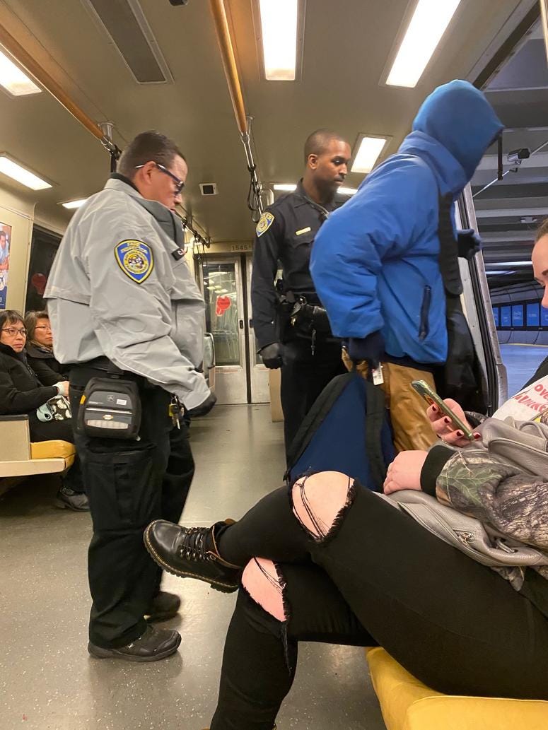 BART rider escorted from train by fare inspector and BART Police officer BART rider escorted from train by fare inspector and BART Police officer