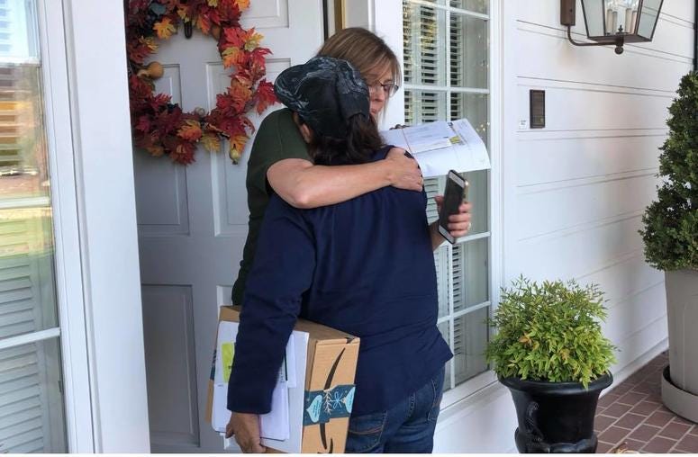 Postal worker Bernadette Laos embraces a customer on her route in Sonoma County. Laos' home was destroyed by the Kincade Fire. Postal worker Bernadette Laos embraces a customer on her route in Sonoma County. Laos' home was destroyed by the Kincade Fire.