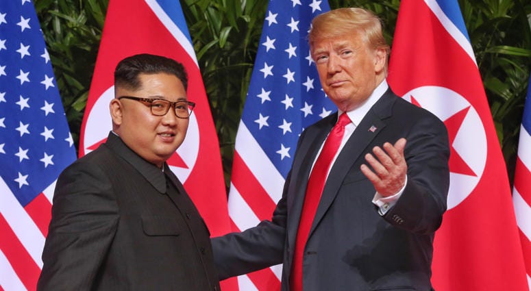 Kim Jong Un and President Donald Trump SINGAPORE, June 12, 2018 (Xinhua) -- Top leader of the Democratic People's Republic of Korea (DPRK) Kim Jong Un (L) meets with U.S. President Donald Trump in Singapore, on June 12, 2018. (Xinhua/The Straits Times) (zcc) (Photo by Xinhua/Sipa USA)