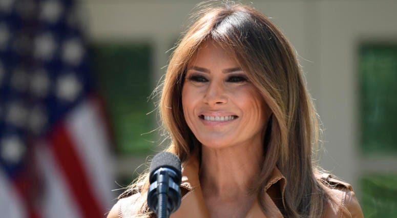 AP18134697750433 In this May 7, 2018 photo, First lady Melania Trump speaks on her initiatives during an event in the Rose Garden of the White House in Washington. The White House says Melania Trump is hospitalized after undergoing a procedure to treat a benign kidney con
