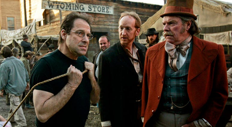 AP18206637409244 In this Feb. 9, 2005 file photo, David Milch, left, creator of the HBO series "Deadwood," appears on the set with Larry Cedar, center, and Peter Jason in Santa Clarita, Calif. HBO says it's greenlighted a long-discussed movie based on the Western drama th