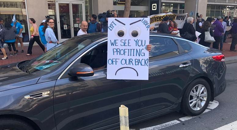 Hundreds of Uber and Lyft drivers rallied in San Francisco on Aug. 27, 2019, demanding that the ride-hail companies grant them the status of employees rather than independent contractors who lack benefits. Hundreds of Uber and Lyft drivers rallied in San Francisco on Aug. 27, 2019, demanding that the ride-hail companies grant them the status of employees rather than independent contractors who lack benefits.