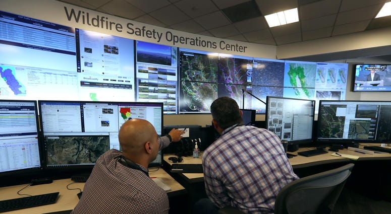 nalysts at the Pacific Gas and Electric (PG&E) Wildfire Safety Operations Center monitor a wildfire on August 05, 2019 in San Francisco, California. nalysts at the Pacific Gas and Electric (PG&E) Wildfire Safety Operations Center monitor a wildfire on August 05, 2019 in San Francisco, California.