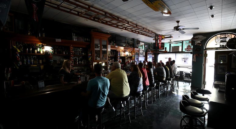 athy Sanchez bartends at The Town Square bar where the lights are out on October 10, 2019 in Sonoma, California. athy Sanchez bartends at The Town Square bar where the lights are out on October 10, 2019 in Sonoma, California.