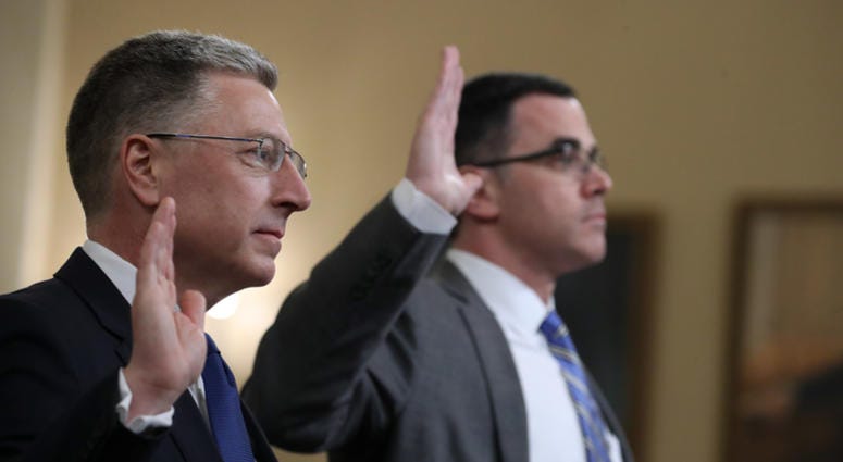 Former State Department special envoy to Ukraine Kurt Volker (L) and former National Security Council Senior Director for European and Russian Affairs Tim Morrison are sworn in before testifying to the House Intelligence Committee on Nov. 19, 2019. Former State Department special envoy to Ukraine Kurt Volker (L) and former National Security Council Senior Director for European and Russian Affairs Tim Morrison are sworn in before testifying to the House Intelligence Committee on Nov. 19, 2019.
