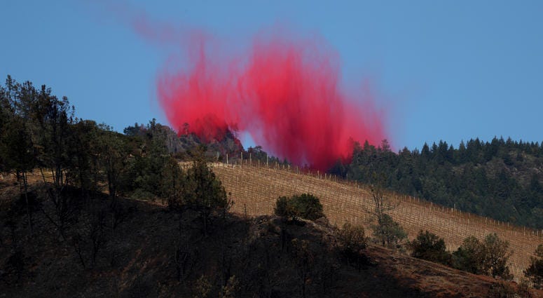 ire retardant lingers in the air after being dropped by a plane ahead of the Kincade Fire on October 29, 2019 in Healdsburg. ire retardant lingers in the air after being dropped by a plane ahead of the Kincade Fire on October 29, 2019 in Healdsburg.
