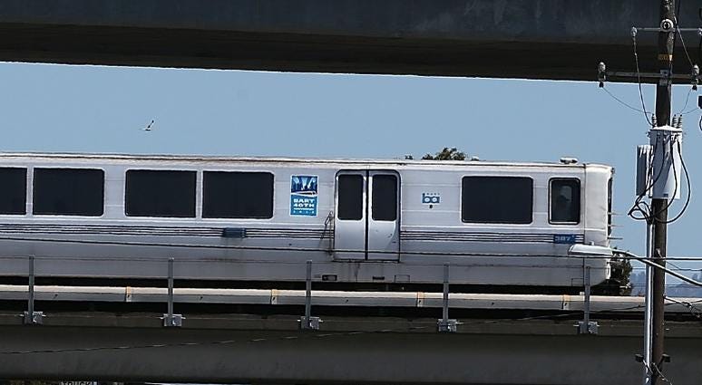 : A Bay Area Rapid Transit (BART) train travels towards downtown Oakland on August 2, 2013 in Oakland, California. : A Bay Area Rapid Transit (BART) train travels towards downtown Oakland on August 2, 2013 in Oakland, California.