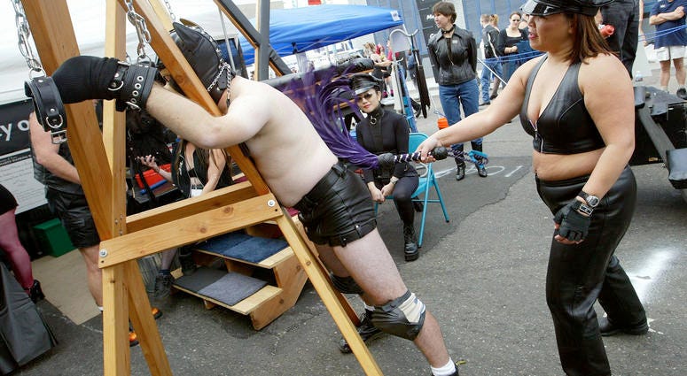 A man is whipped by a woman at the 20th Annual Folsom Street Fair September 28, 2003 in San Francisco, California. A man is whipped by a woman at the 20th Annual Folsom Street Fair September 28, 2003 in San Francisco, California.