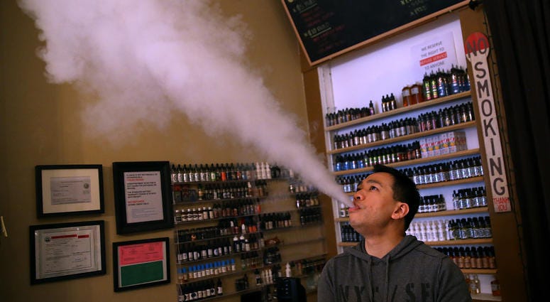 Christopher Chin blows vapor from an e-cigarette at Gone With the Smoke Vapor Lounge on May 5, 2016 in San Francisco, California. Christopher Chin blows vapor from an e-cigarette at Gone With the Smoke Vapor Lounge on May 5, 2016 in San Francisco, California.