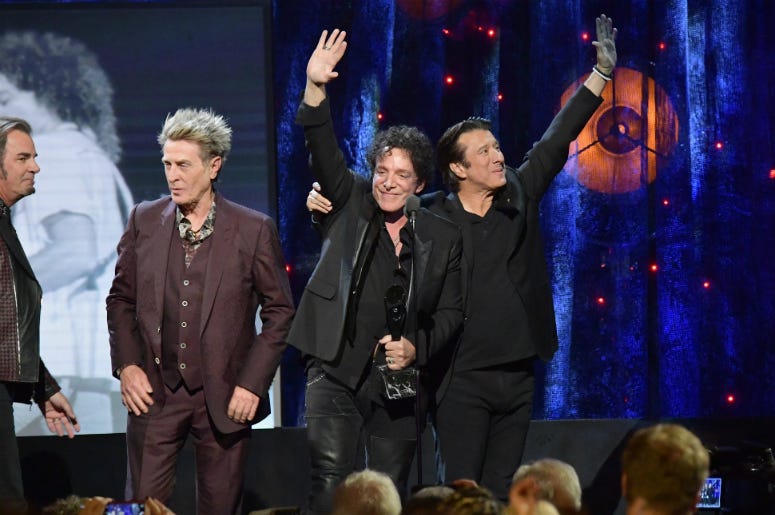 Ross Valory, Neal Schon, and Steve Perry of Journey onstage at the 32nd Annual Rock & Roll Hall Of Fame Induction Ceremony Ross Valory, Neal Schon, and Steve Perry of Journey onstage at the 32nd Annual Rock & Roll Hall Of Fame Induction Ceremony