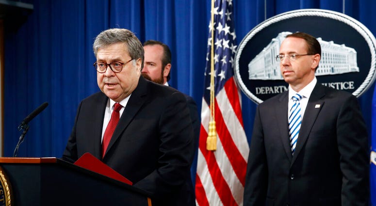William Barr speaks alongside Deputy Attorney General Rod Rosenstein, right, and Deputy Attorney General Ed O'Callaghan, rear left, about the release of a redacted version of special counsel Robert Mueller's report during a news conference AP DO NOT USE